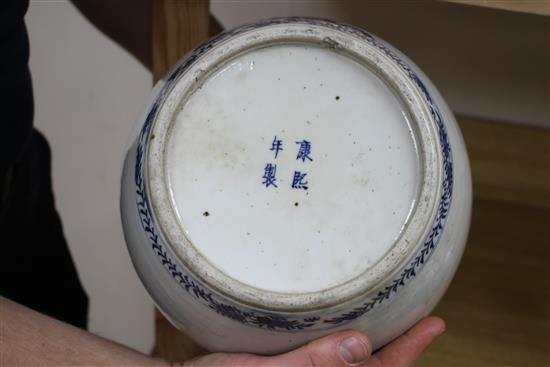 A large Chinese blue and white jar, Kangxi mark, 19th century, the wood cover inset with a jade plaque height 34cm